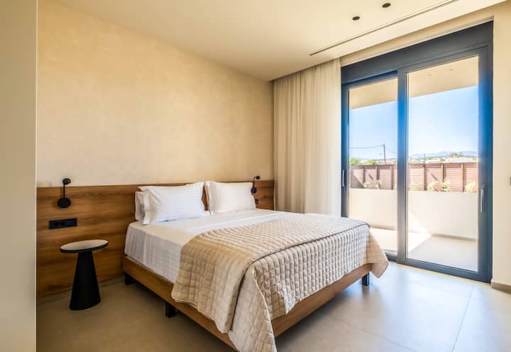 Villa 2 - Ground Floor - Bedroom 8 with queen bed, ensuite bathroom and garden access