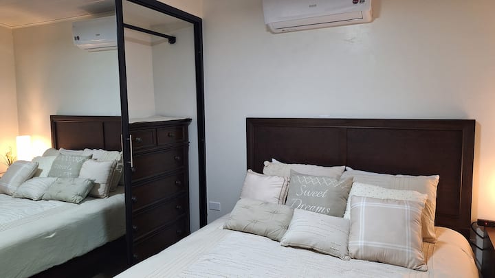 A serene bedroom designed for rest, where soft tones and quiet comfort invite deep, peaceful sleep.