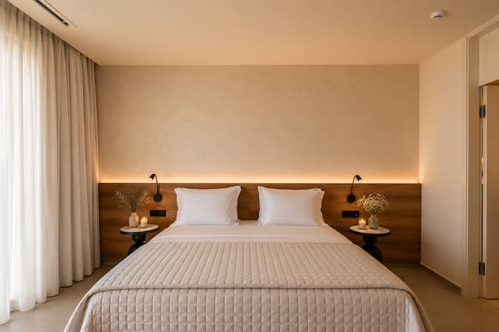 First Floor - Bedroom 2 with queen bed, ensuite bathroom and balcony access