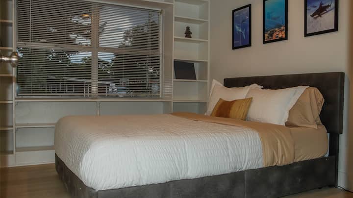 Comfortable second bedroom with a queen-sized bed, perfect for a peaceful stay.