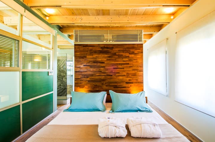 First Floor - Master Bedroom 1 with king bed, ensuite bathroom with jacuzzi and balcony access