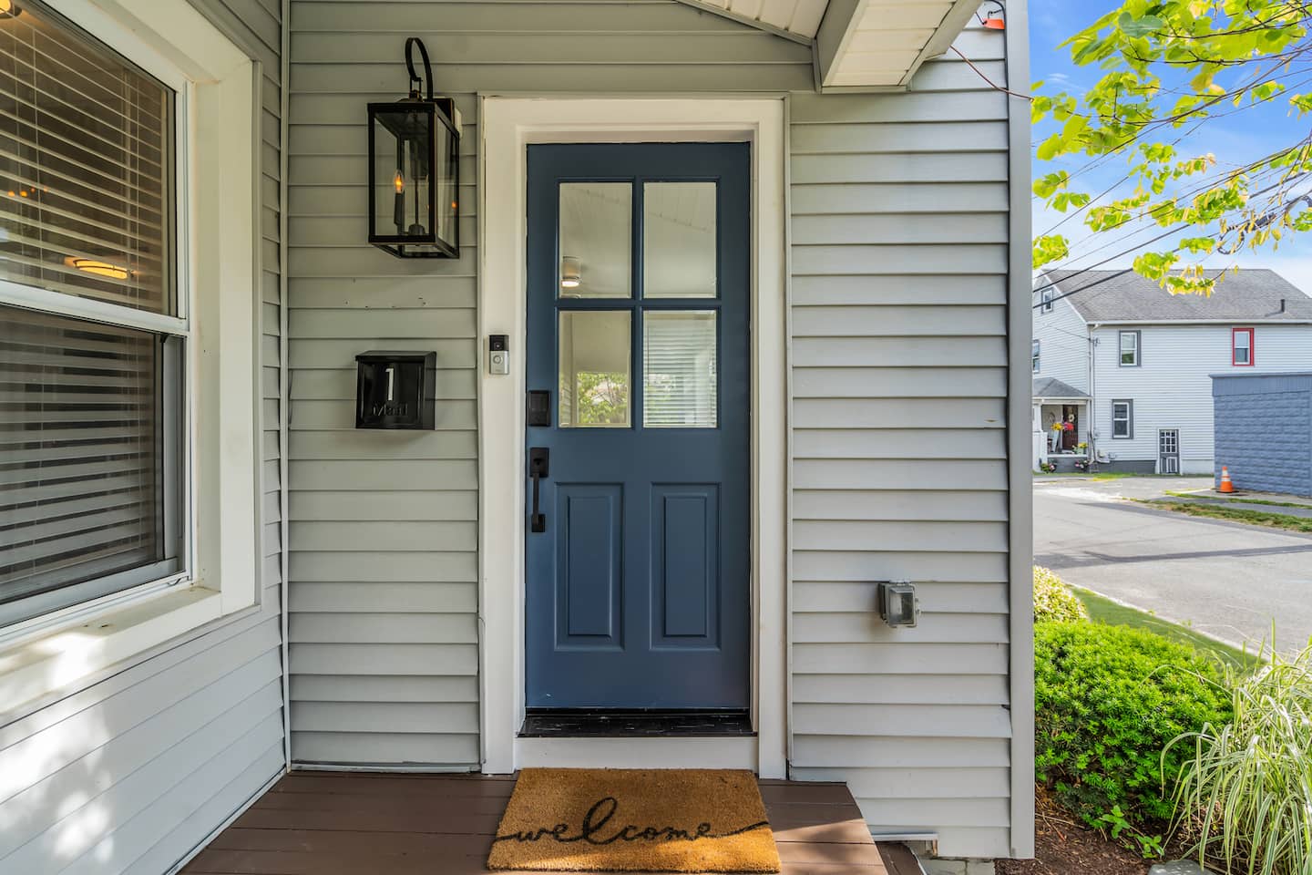 Let yourself in with the keypad, no key handoff needed. The navy front door and private entrance make every arrival simple, even after a late drive in.