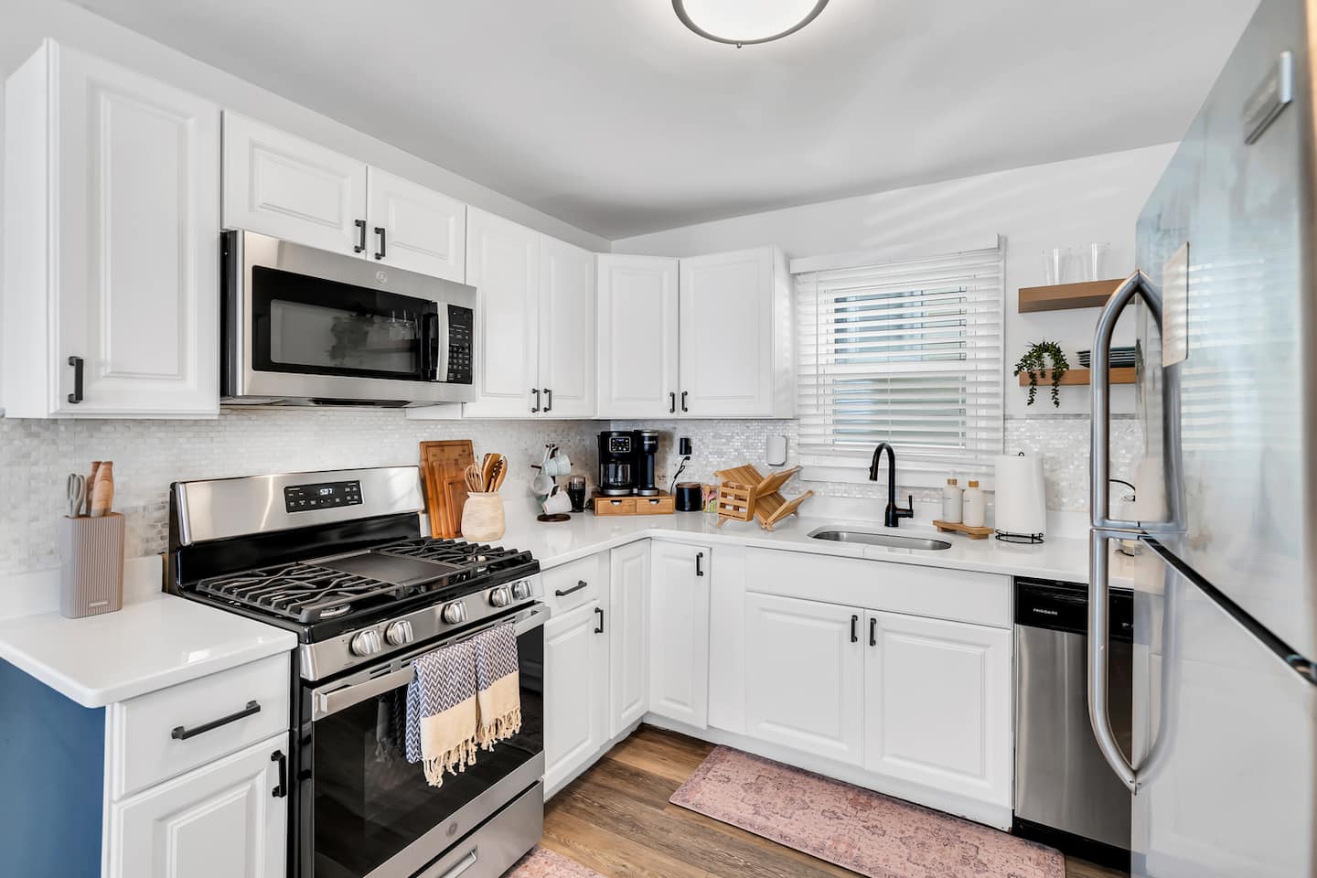 Cook breakfast before the beach or a full dinner after. You have a gas range, stainless appliances, and granite counters with real room to work.