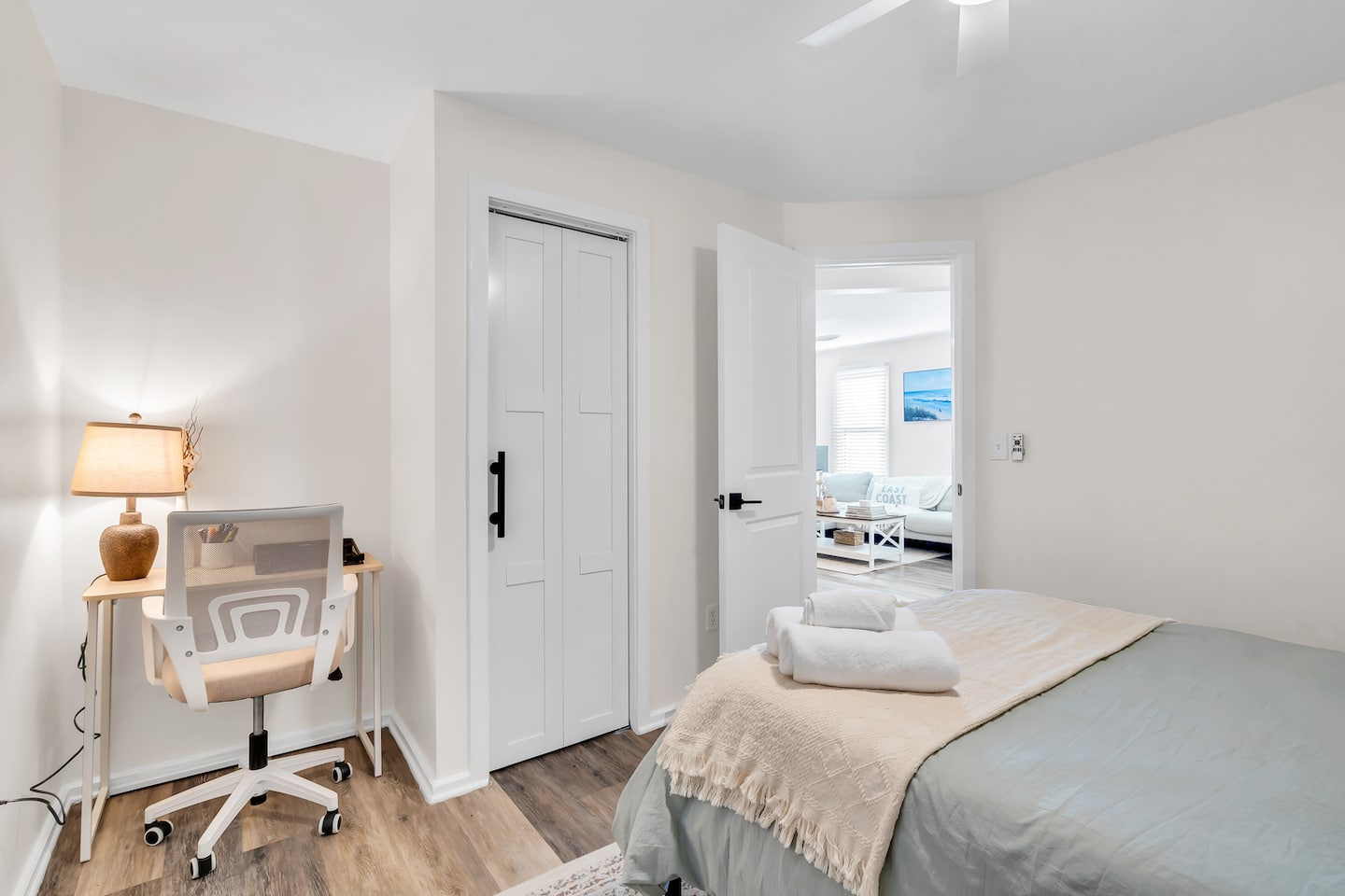 Bedroom two with a double bed and a dedicated desk with an office chair