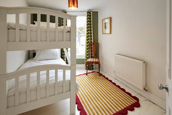 Funky bunk room, with black out Orla Kiely curtains.