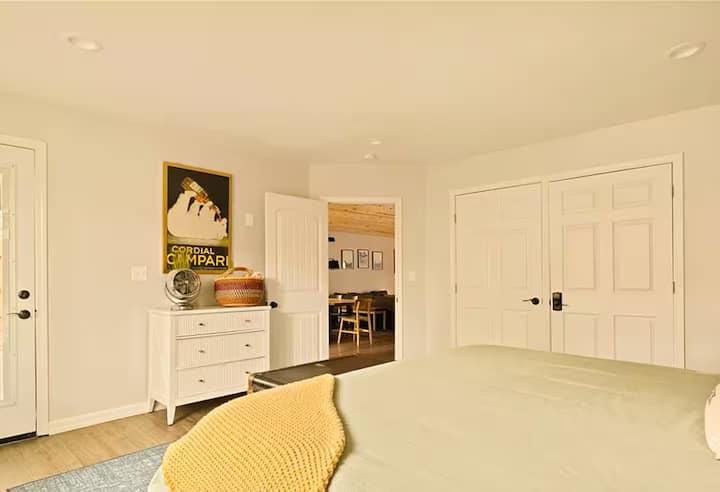 Large king in master, private en suite, work station, and private door to back deck. 