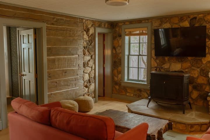 Step into a cozy television room filled with antique charm and historic character