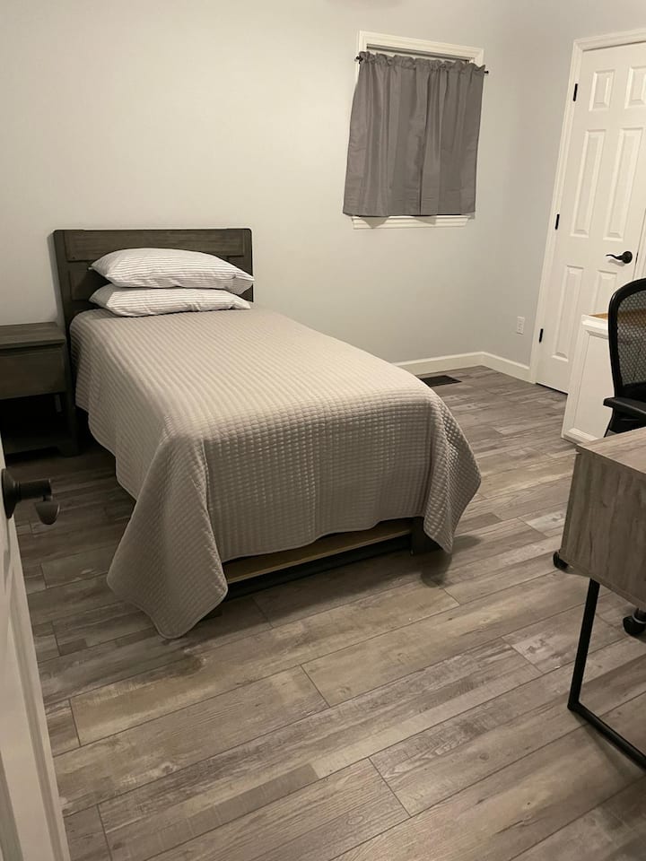 This is a trundle bed with a twin mattress at the bottom on a base that rolls out. 