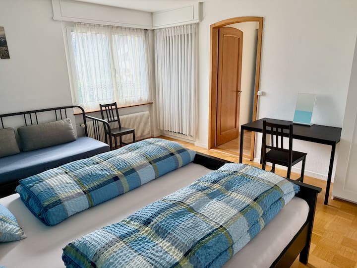 bedroom no.1 (photo 1): double bed, single bed, 1 desk, 2 chairs, doors to balcony + bedroom no.3