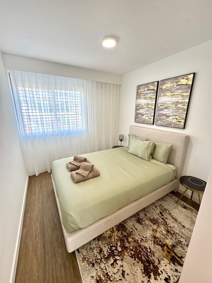 Spacious second bedroom with a comfortable bed, large wardrobe, and beautiful mountain views. Quiet, restful, and perfect for family or friends.