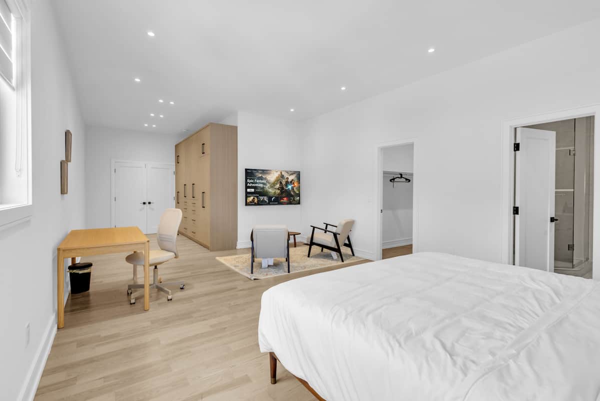 Grand king suite bedroom with king bed in a Mississauga short term rental