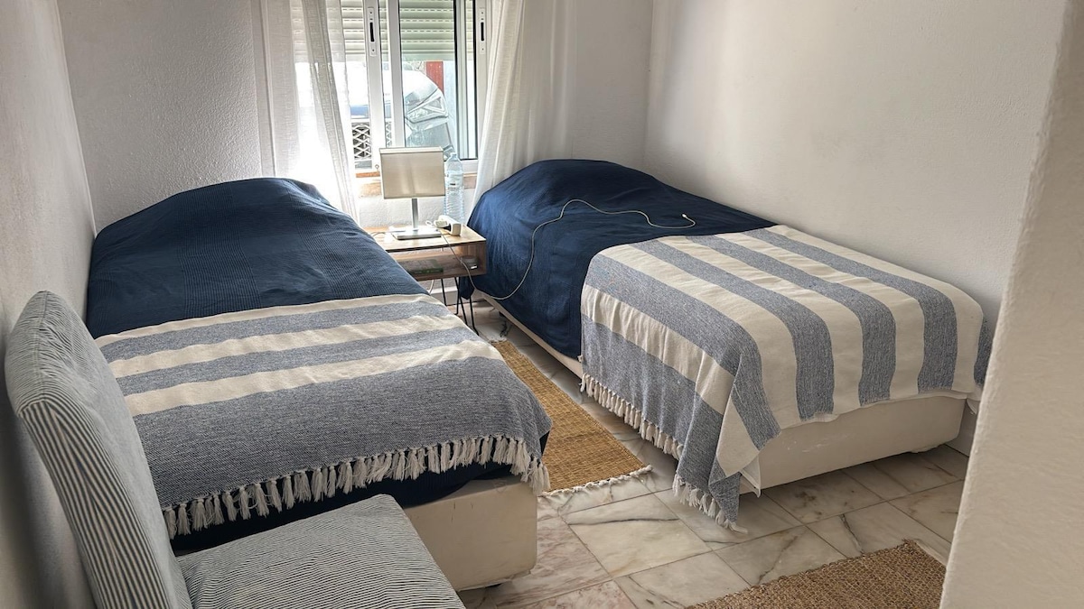 Bedroom three with two single beds