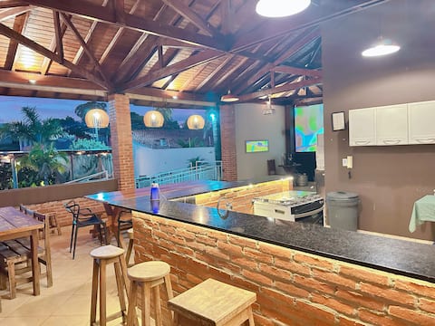 Top space: pool, big screen, karaoke, fire pit and AC