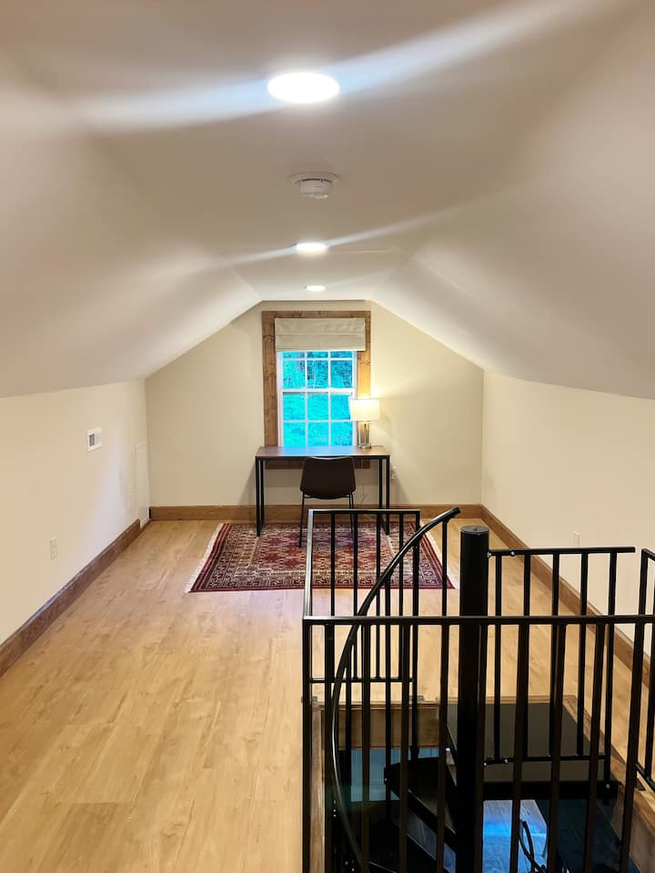 Work Space with desk and chair in loft area