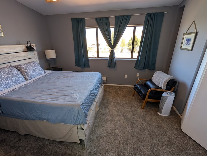 Your main bedroom has a queen size, memory, foam bed, and a view of the mountains.