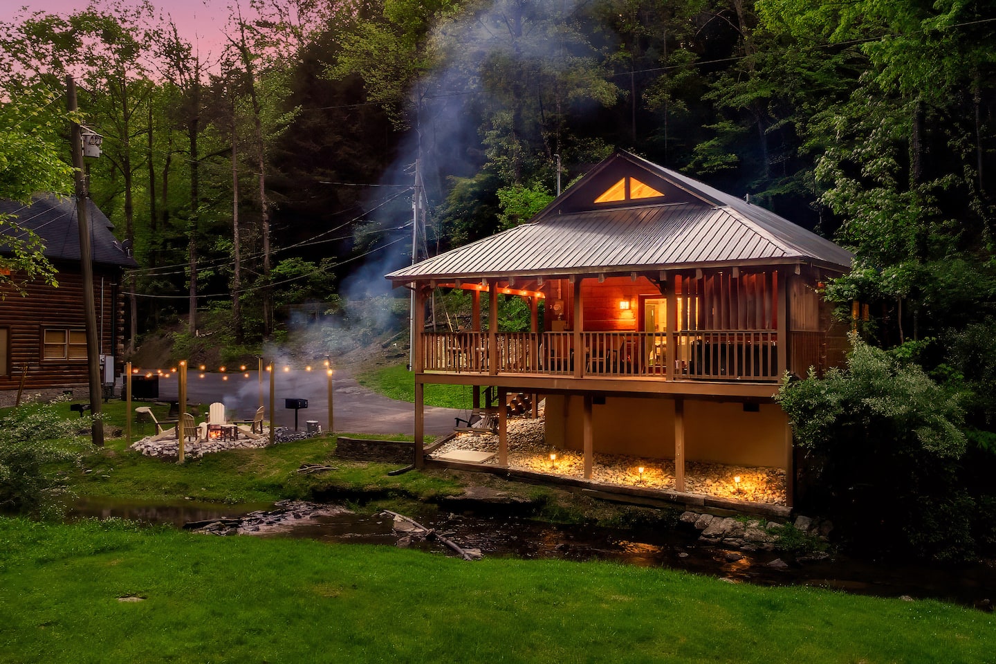 Wooded backyard and peaceful creek bank beside the cottage