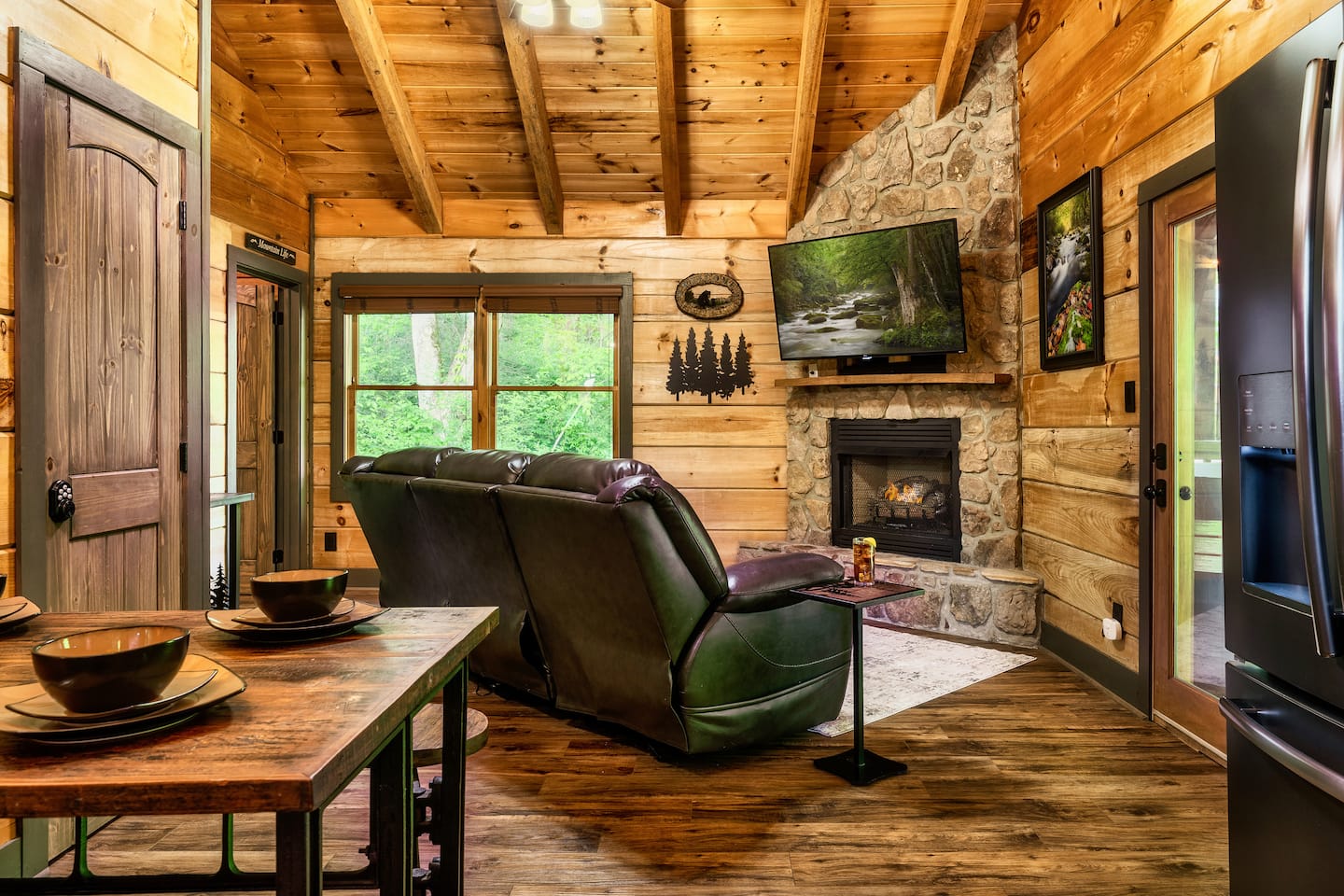Open living room with comfortable seating, fireplace, and Smart TV