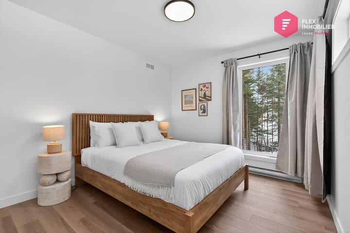 Comfortable Bedroom #1 on the main floor with a queen-size bed