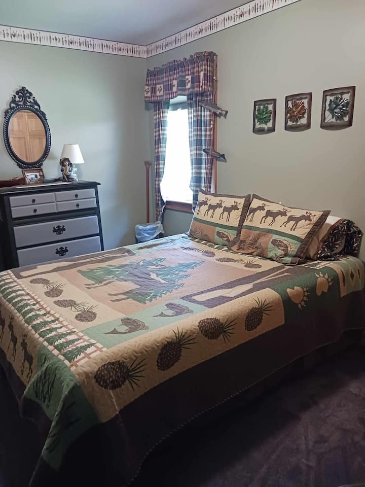 Full size bed, dresser, and closet space.