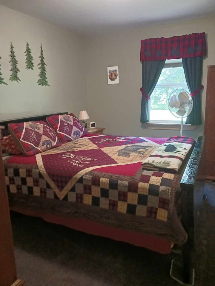 Queen size bed, dresser, and ceder armoire.