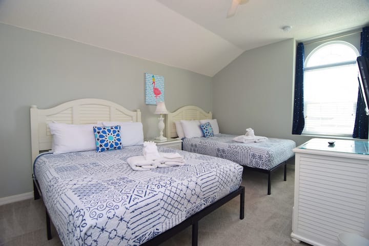 Bedroom 4 sleeps 2 guests and has a TV and ceiling fan.
