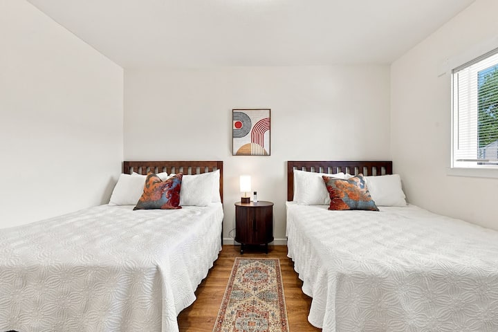 A shared bedroom with two double beds.