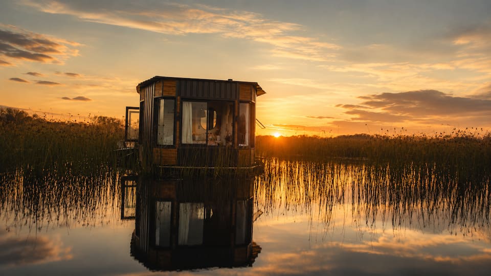 A floating cabin hidden in the reeds, Pearly Beach, Western Cape, South Africa, photo 1 of 10