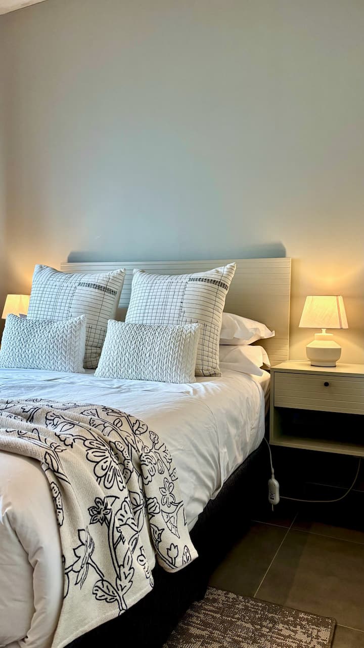 The second bedroom offer a comfortable and inviting space with a double bed, premium linen and soft pillows for a restful night's sleep.