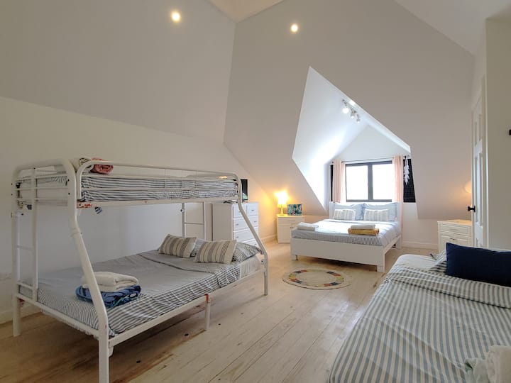 Loft bedroom - with 1 Queen bed, 1 single bed, and 1 bunk bed consisting of a double bed below and a single bed on top. Ensuite