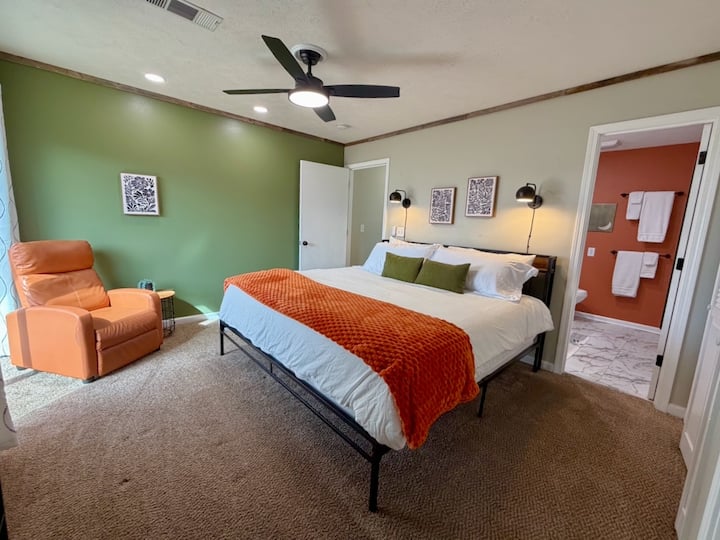 The primary bedroom offers a king size bed featuring crisp, fresh linens and 4 king size pillows. And, a recliner provides a cozy place to watch TV or read a book.