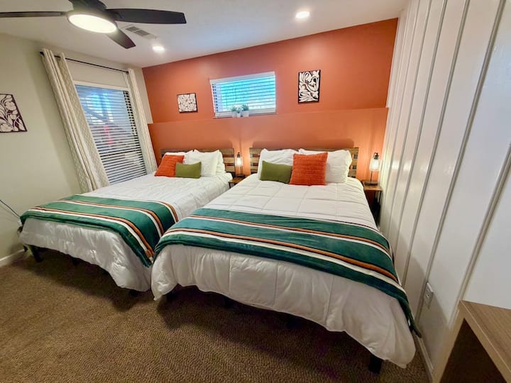 The second bedroom offers 2 queen beds featuring soft, comfortable linens & 4 fluffy pillows each.