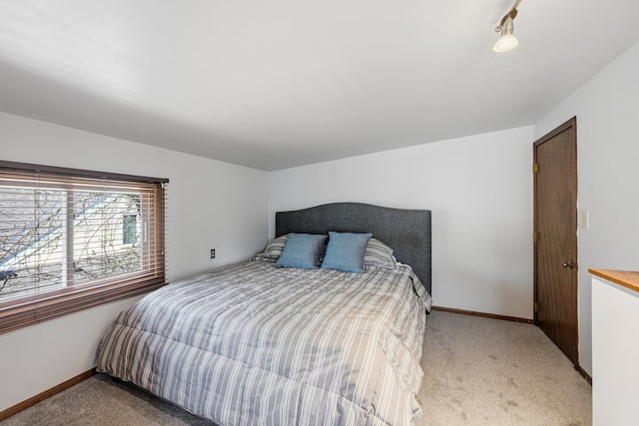 Upstairs bedroom #1. This bedroom features a queen-sized bed and custom closets. Carpeting is just a year old in this space.