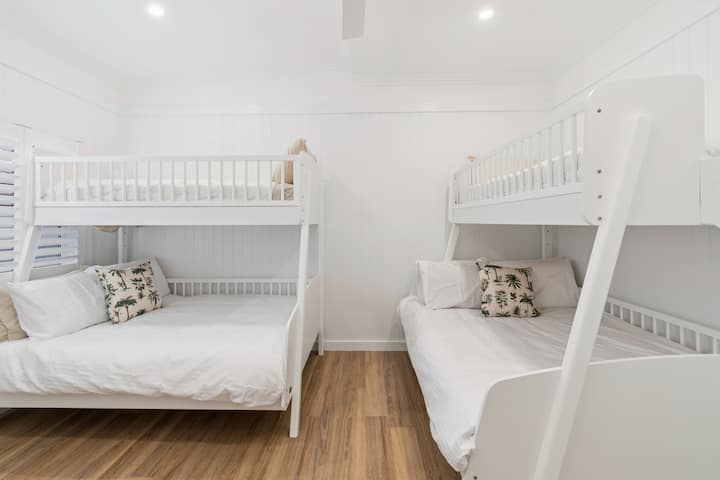 Designed for flexibility, the third bedroom features two bunk beds with double beds below and single beds above, well-suited to families or groups.