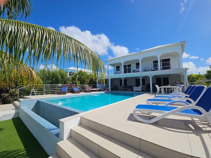 Grand Waterfront Villa | Sleeps 12, Pool And Games - Antigua and Barbuda