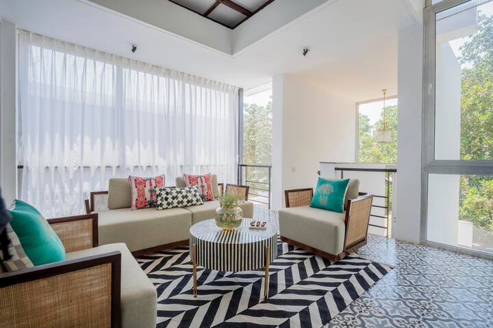 Unwind in this bright and breezy lounge area, designed as the perfect spot for relaxation and casual conversations.