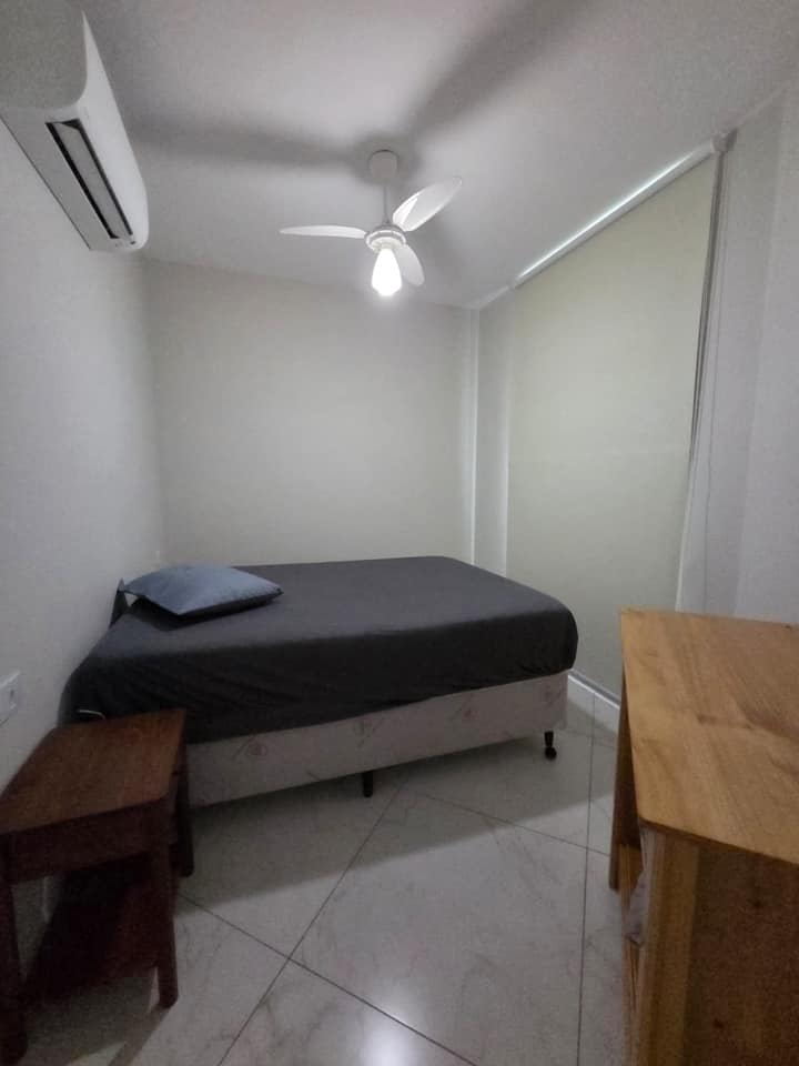 Bedroom with a double bed, air conditioning, and ocean view.