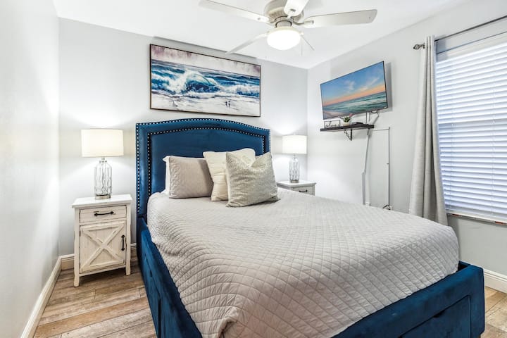 Secondary Guest Bedroom, with Queen Bed, storage drawers, and closet with hangers