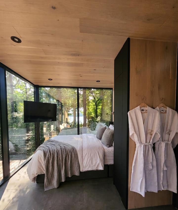 Wake up surrounded by trees, with the lake just steps away