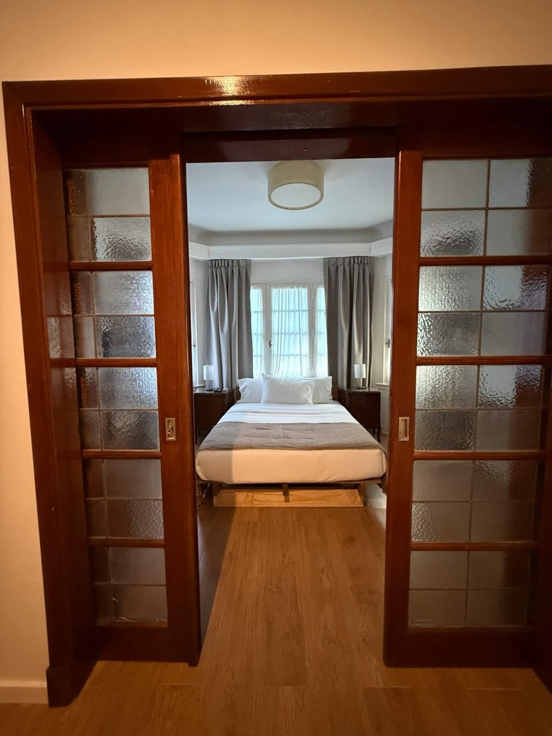 Suite with kitchen, living area, and private bathroom