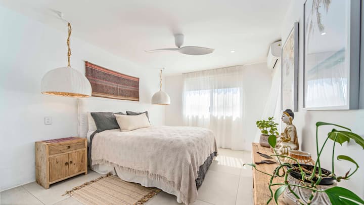 Master bedroom with ceiling fan, AC, storage and access to the balcony