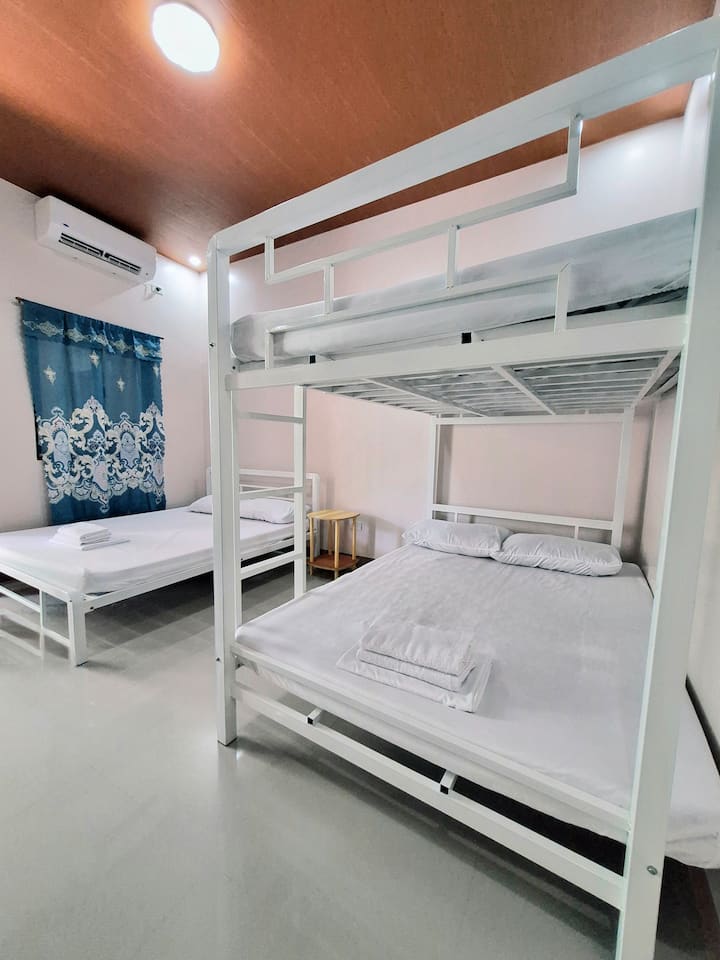• AC bedroom: 1 queen bed + 1 double bunk bed (up to 6 guests)
• Floor beds available for 4 more guests
• Max capacity: 10 guests