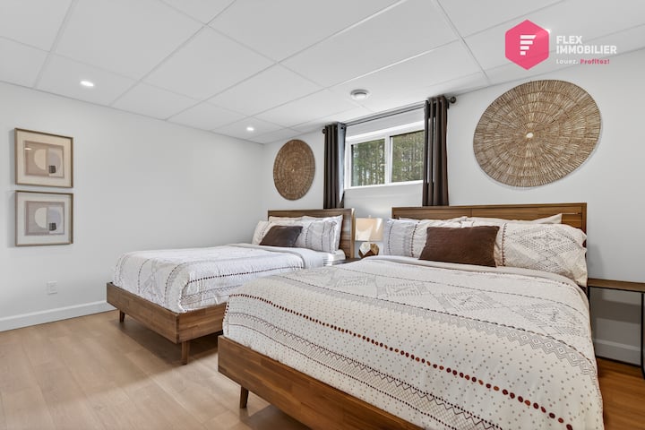 Comfortable bedroom #4 in the basement with 2 queen beds and double wardrobe