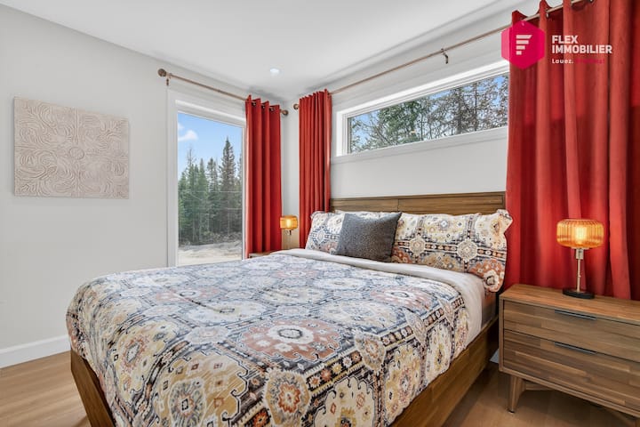 Comfortable bedroom #1 on the main floor with a queen-size bed and a double closet