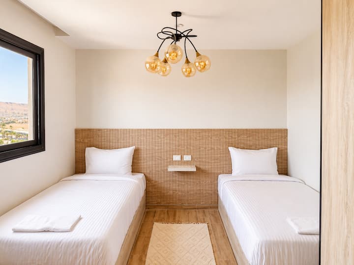 Bedroom 1 with two single beds