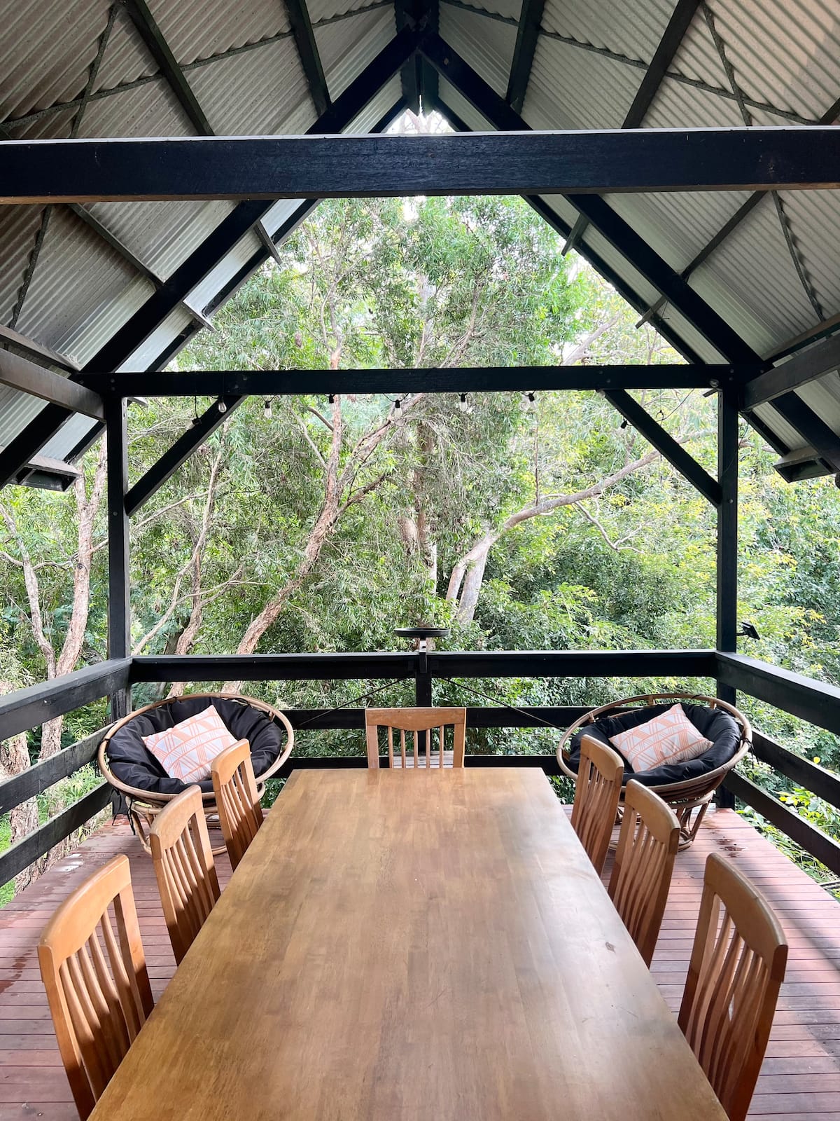 Mountain home nestled among the trees — photo via the host's Airbnb listing