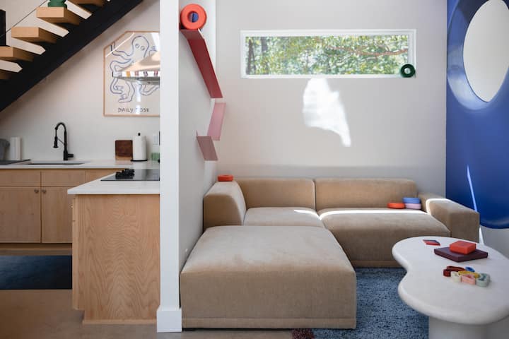 Modern designer lounge with cozy sectional and bright natural light