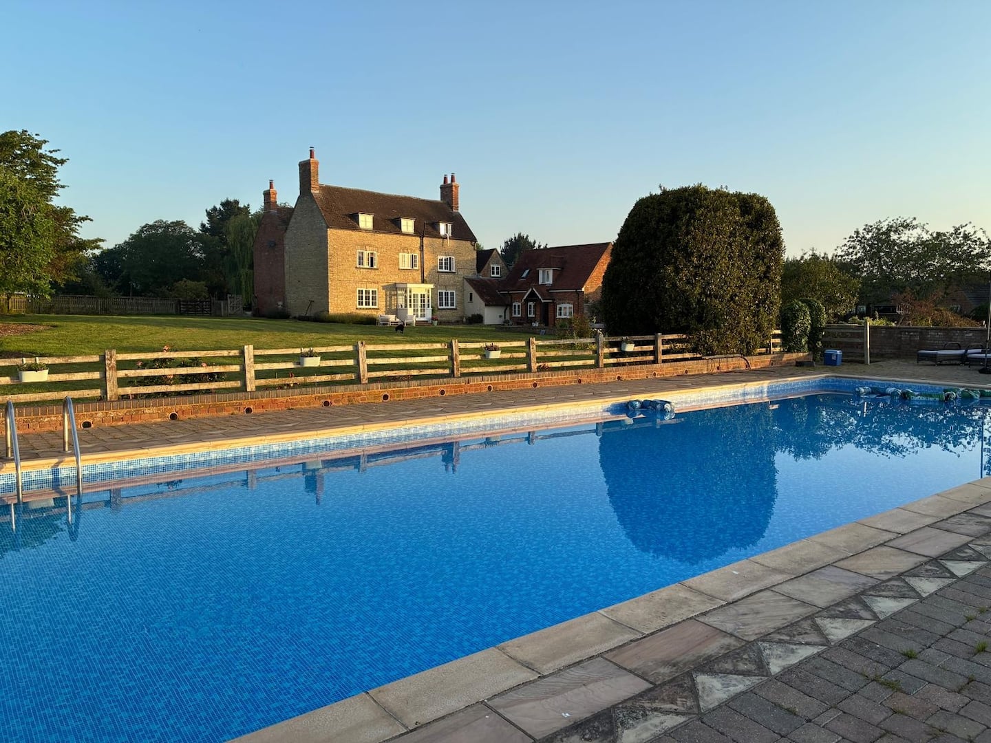 The outdoor heated pool and countryside setting