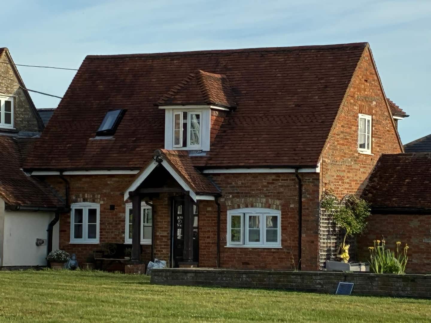 The red-brick Garden Annex overlooking the lawn in Chicheley