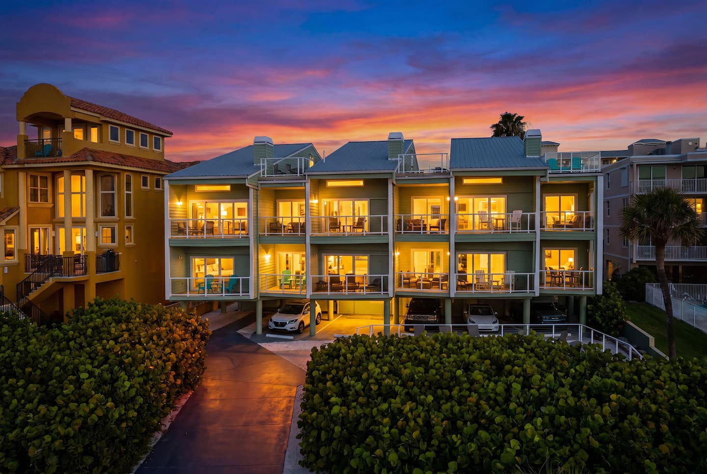 Direct oceanfront, the condo at golden hour, Gulf out front.