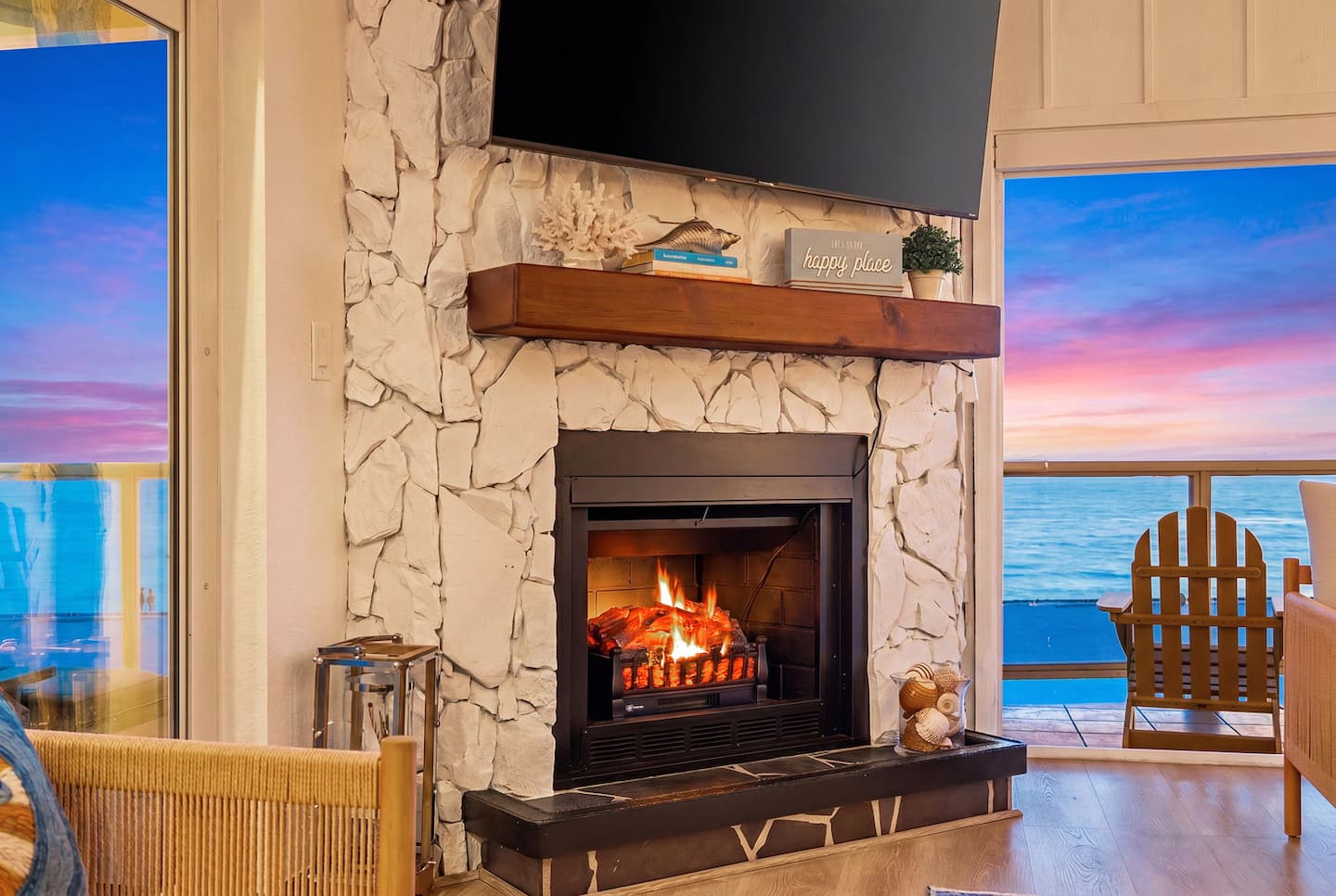 70-inch Roku TV above the fireplace, watch the TV and the Gulf at once.